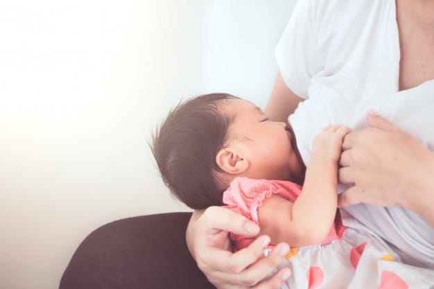 mother-breastfeeding-her-newborn-baby-girl_7186-2531 A mother is breastfeeding her baby | BookDoc