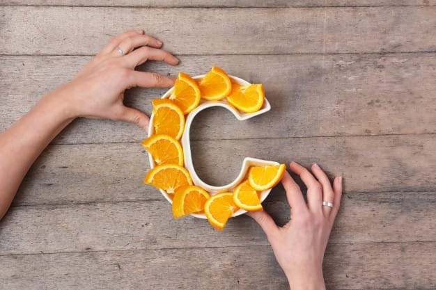 woman-hands-holding-plate-shape-letter-c_71237-22 Health Benefits of Vitamin C