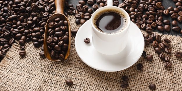 close-up-cup-coffee-with-beans_23-2148336712 Effects Of Caffeine On Children | BookDoc