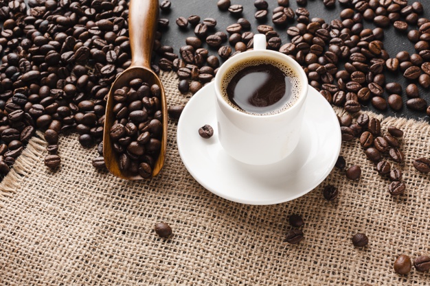 close-up-cup-coffee-with-beans_23-2148336712 Effects Of Caffeine On Children | BookDoc
