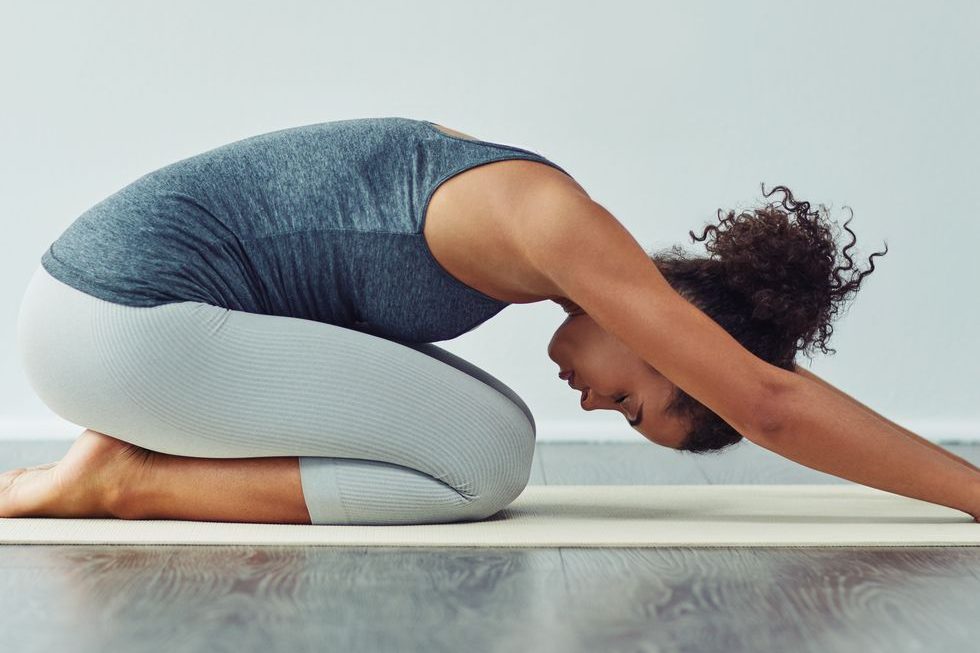 child pose stretch after waking up | BookDoc