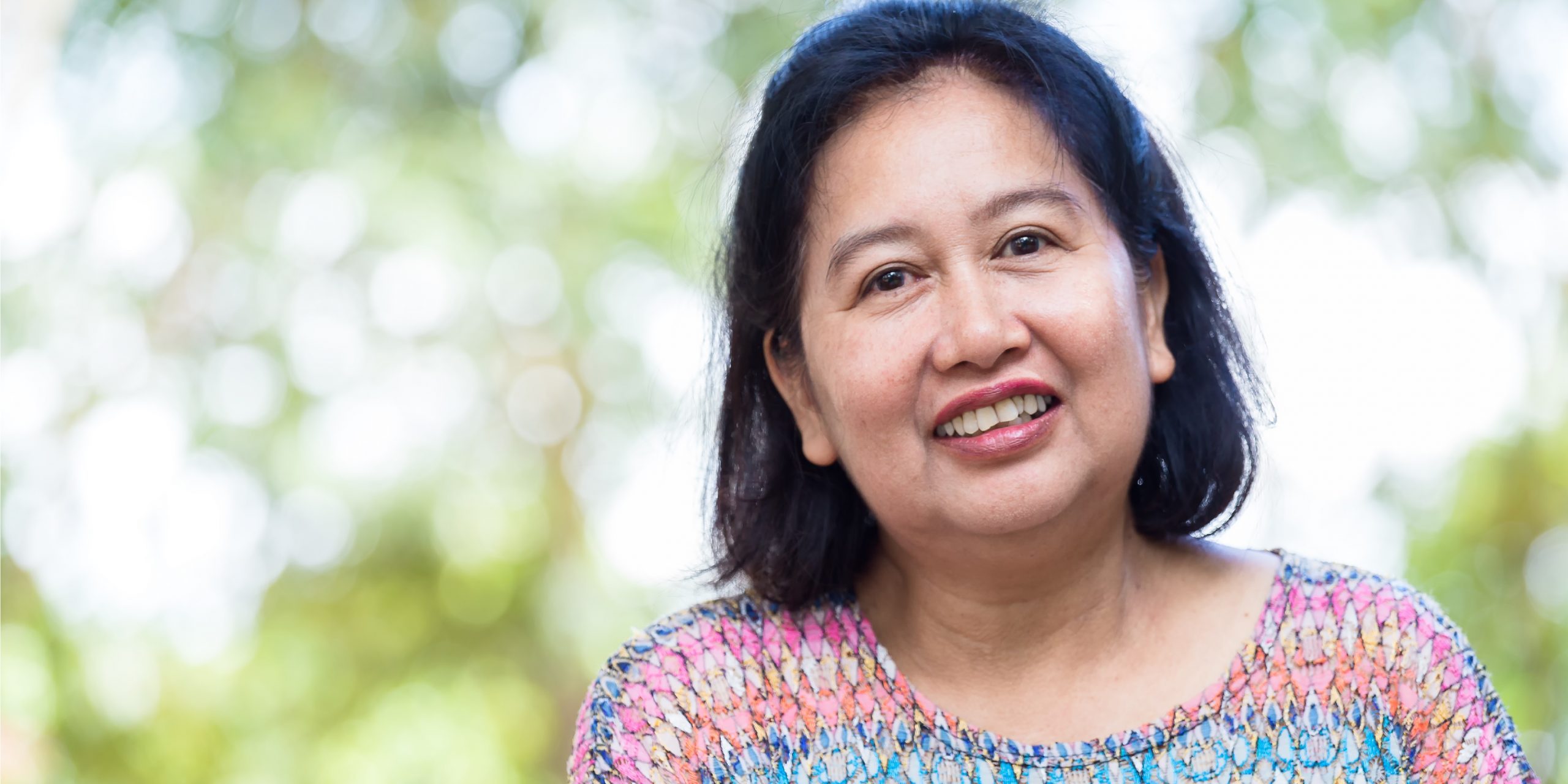 Portrait Middle aged female with happiness A happy middle aged woman | Osteoporosis in woman | BookDoc