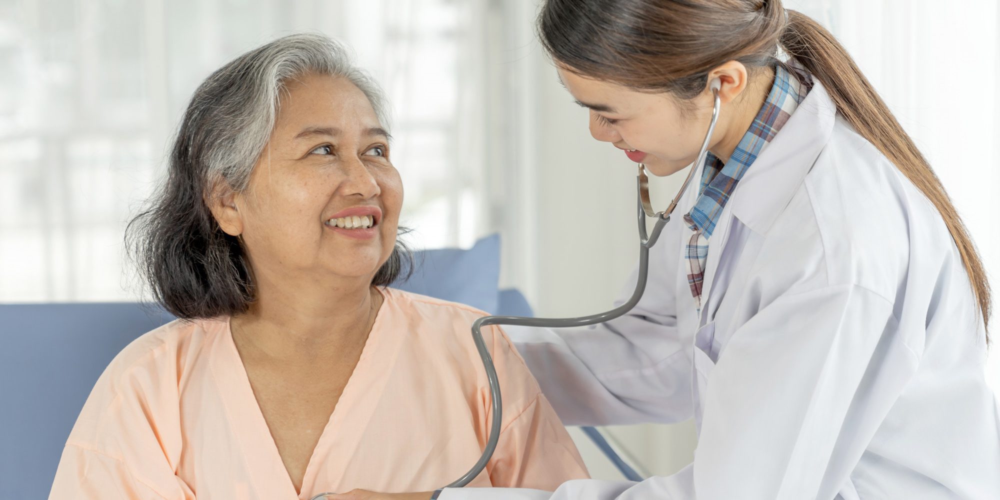 Health Articles | Doctor checking patient heart beat featured image in essential test blog post | BookDoc