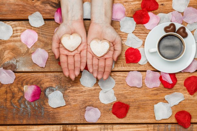 valentines-day-concept-female-hands-with-hearts-wooden-with-flower-petals-cup-coffee Valentine background photo | BookDoc