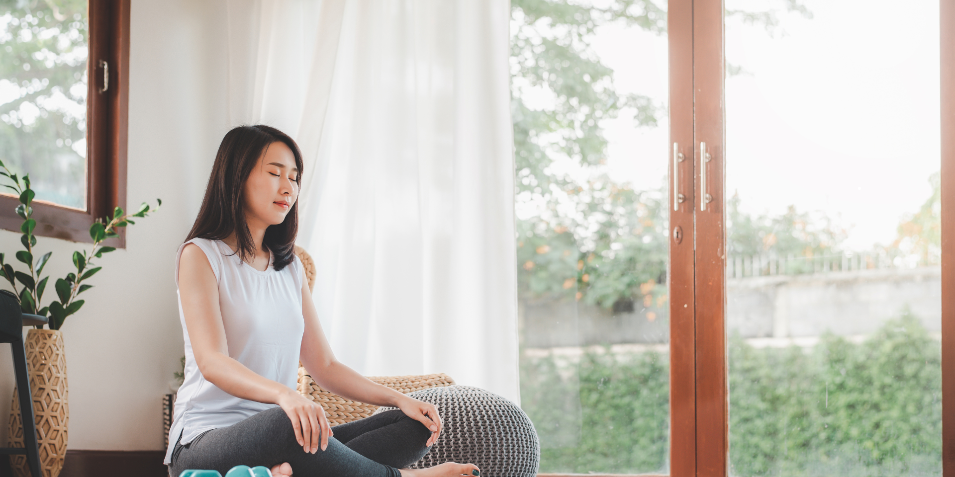meditation a woman is meditating | featured image for productivity secrets through meditation | BookDoc