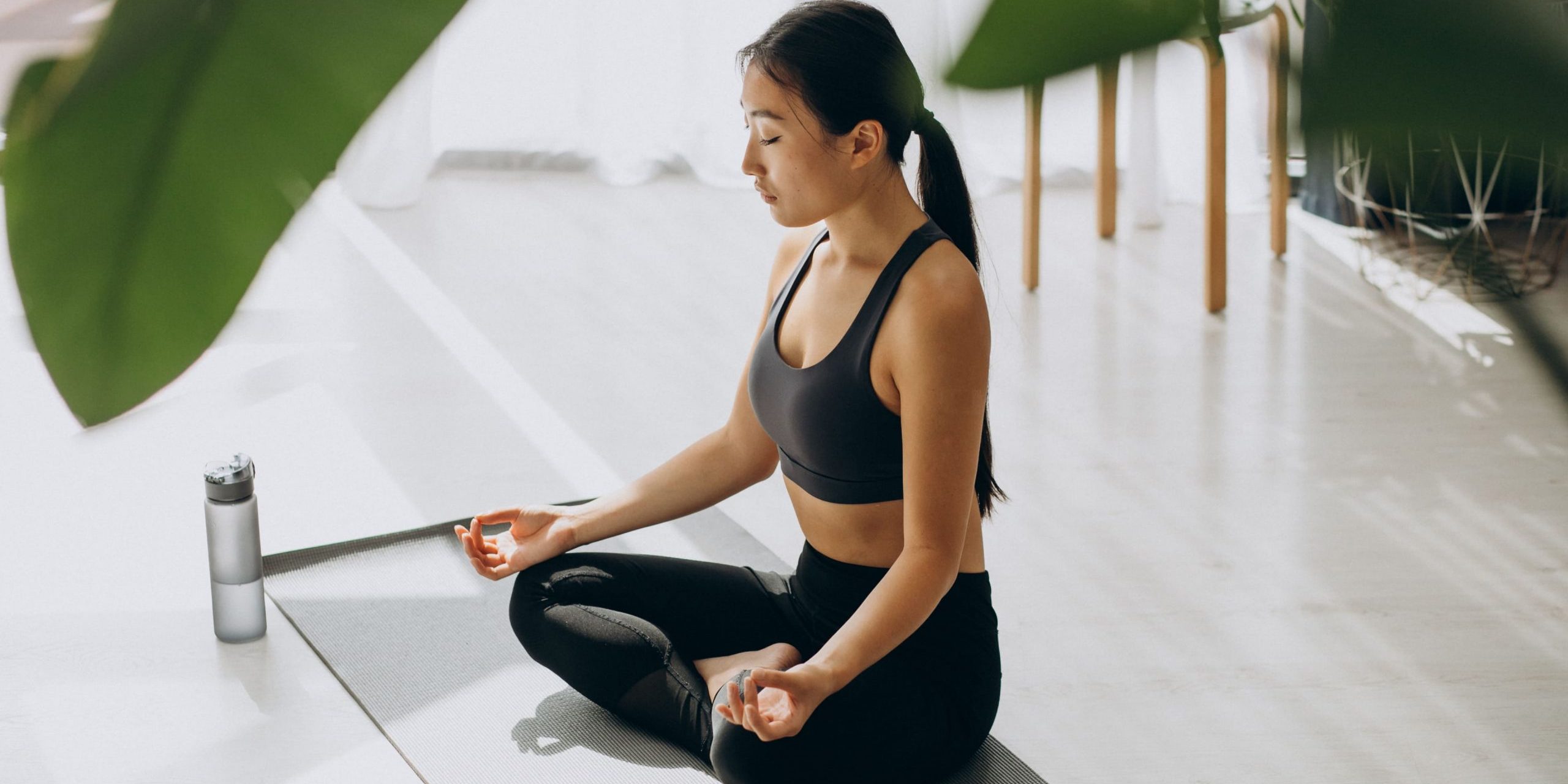 woman-practicing-yoga-mat-home (1)